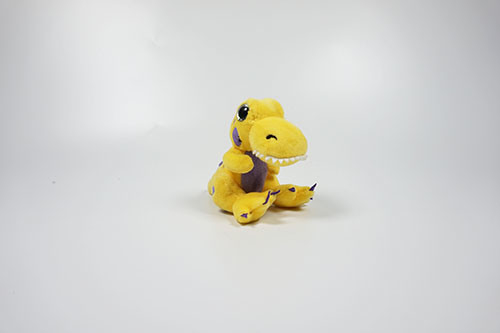 Dinosaure de dessin animé en peluche