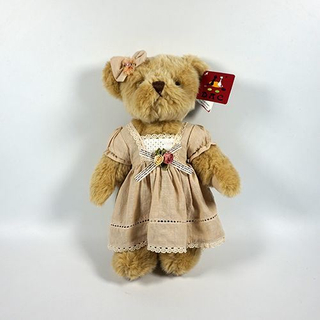 Ours articulé en fourrure brune en peluche avec vêtements